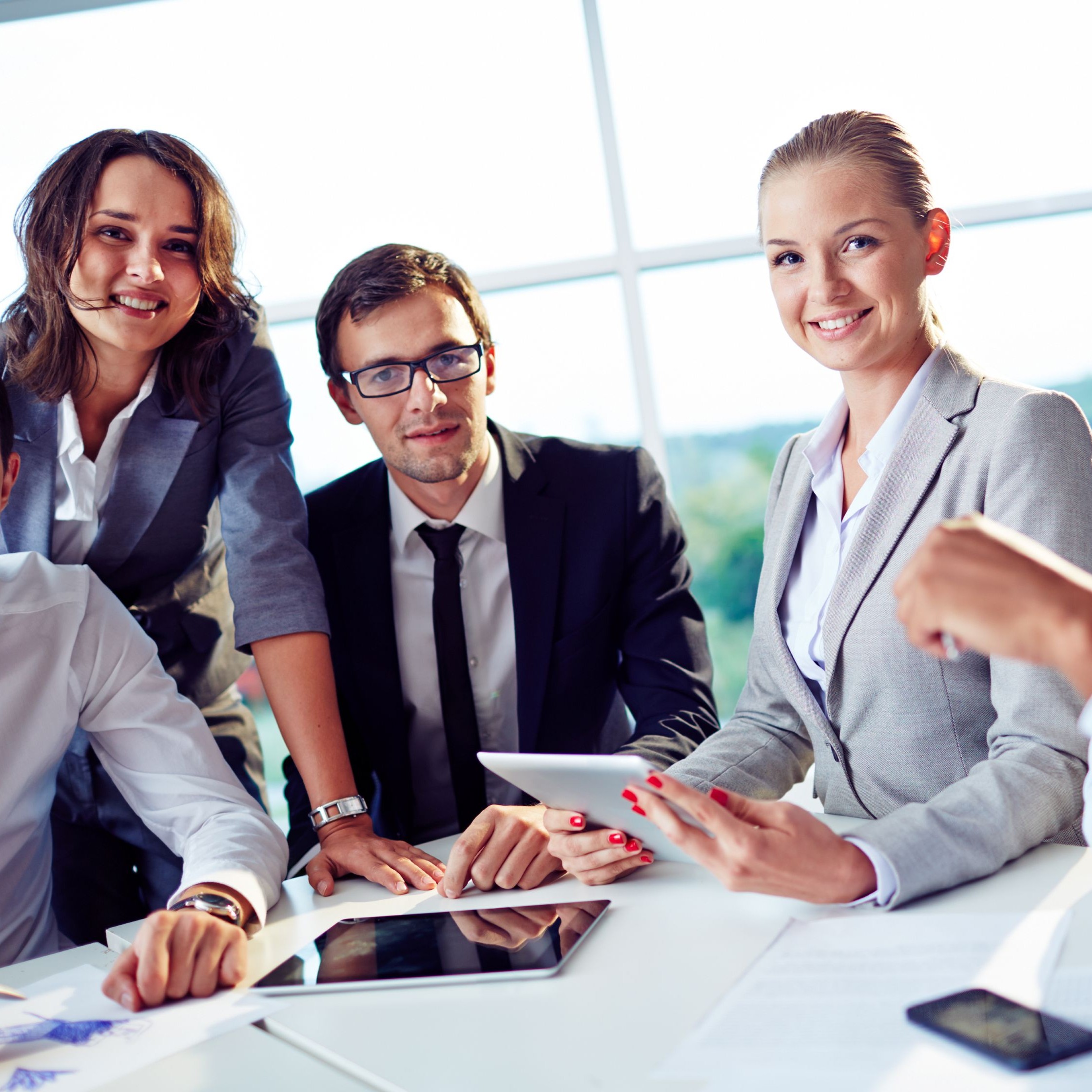 smiling-businesspeople-having-business-meeting eden sqr